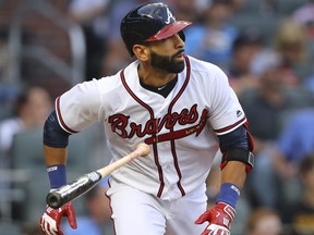 Atlanta Braves' Jose Bautista hits a double during his first at-bat for the team during the first inning against the San Francisco Giants on Friday, May 4, 2018, in Atlanta. Is that really a bat flip? (Curtis Compton/Atlanta Journal-Constitution via AP)