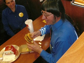 Don Gorske holds a Big Mac in a file photo. (Courtesy Don Gorske/Postmedia Network)
