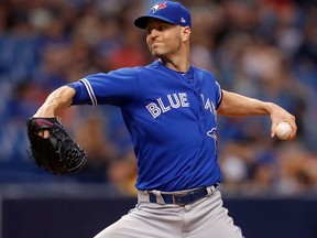 J.A. Happ of the Toronto Blue Jays throws in the fourth inning of a baseball game against the Tampa Bay Rays at Tropicana Field on May 4, 2018