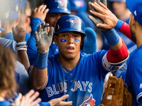 Yangervis Solarte of the Toronto Blue Jays celebrates after hitting a grand slam off Tyler Olson of the Cleveland Indians at Progressive Field on May 3, 2018