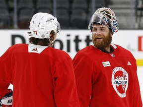 Washington Capitals goaltender Braden Holtby, right, talks with right wing T.J. Oshie during practice Tuesday, May 29, 2018, in Las Vegas. (AP Photo/Ross D. Franklin)