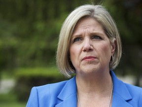 Ontario NDP Leader Andrea Horwath speaks with senior citizen homeowners at a campaign event in Mississauga, Ont., on Saturday, June 2, 2018. THE CANADIAN PRESS/Cole Burston