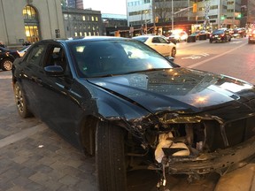 A man impaired driving and other related offences after a car smashed into numerous parked vehicles near Union Station and struck pedestrians causing minor injuries on Friday, May 4, 2018.