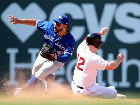 Brock Holt of the Boston Red Sox steals second past Devon Travis of the Blue Jays at Fenway Park on May 30, 2018 in Boston. (Maddie Meyer/Getty Images)
