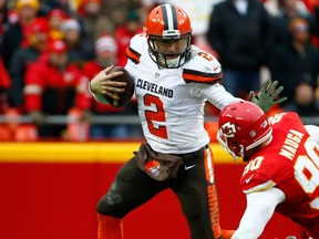 Johnny Manziel of the Cleveland Browns avoids the tackle of Josh Mauga of the Kansas City Chiefs at Arrowhead Stadium during the fourth quarter of the game on December 27, 2015 in Kansas City, Missouri. (Jamie Squire/Getty Images)