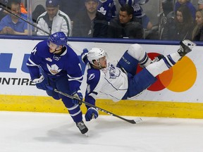 Toronto Marlies' Andreas Johnsson hits Syracuse Crunch's Jake Dotchin during Game 6 of a playoff series at Ricoh Coliseum on May 15, 2017