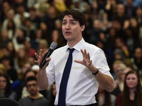 Prime Minister Justin Trudeau answers questions at his cross country town hall meeting at MacEwan University in Edmonton, February 1, 2018.
