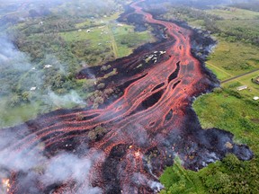 This U.S. Geological Survey (USGS) image obtained May 20, 2018, shows channelized lava emerges on Kilauea Volcano's lower East Rift Zone on May 19, 2018,on Hawaii's Big Island. (AFP PHOTO/U.S. Geological Survey)