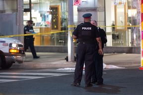 Toronto Police at the scene on Bay St. in Yorkville where Matthew Staikos was fatally shot late Monday, May 28, 2018. (Victor Biro photo)