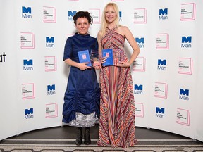 Polish author Olga Tokarczuk, left, stands with translator Jennifer Croft after winning the Man Booker International prize 2018, for her book Flights, at the Victoria and Albert Museum Tuesday, May 22, 2018 in London.