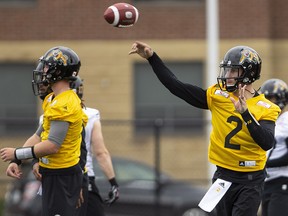Tiger-Cats quarterback Johnny Manziel (2) is seen with teammates on the field at McMaster University during training camp in Hamilton on Sunday, May 20, 2018. (THE CANADIAN PRESS/Peter Power)