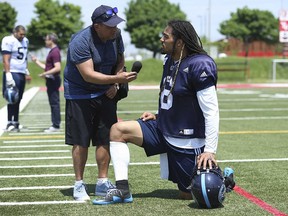 Toronto Sun's Frank Zicarelli interviews Toronto Argos Marcus Ball on the sidelines at practice in preparation for Friday's pre-season matchup with the Hamilton Tiger Cats. (JACK BOLAND/Toronto Sun)