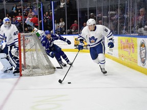 Marlies' Travis Dermott carries the puck as goaltender Garret Sparks looks on during Game 4 against the Crunch in Syracuse on Tuesday, May 8, 2018. (HANDOUT/PHOTO)