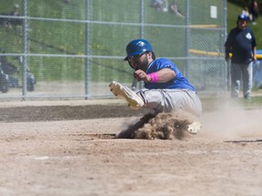 Leafs catcher Justin Marra slides against Guelph yesterday afternoon at Christie Pits. The Leafs cruised to a 14-4 win over the Royals. (Erin Riley/photo)