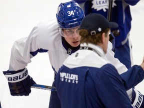 Toronto Maple Leafs centre Auston Matthews listens to coach, Mike Babcock, during practice on Nov. 21, 2016