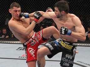 Carlos Condit (right) punches Nick Diaz during UFC 143 at Mandalay Bay Events Center on February 4, 2012 in Las Vegas. (Nick Laham/Zuffa LLC/Zuffa LLC via Getty Images)