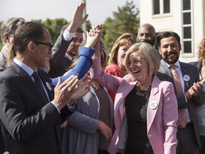 Alberta Premier Rachel Notley is applauded at a press conference after speaking about the Kinder Morgan pipeline project, in Edmonton on Tuesday, May 29, 2018. (THE CANADIAN PRESS/Jason Franson)