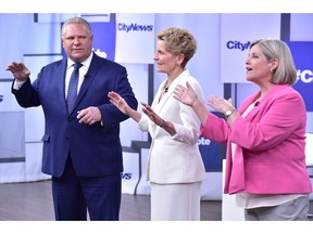 Liberal Premier Kathleen Wynne, centre, Progressive Conservative Leader Doug Ford, left, and NDP Leader Andrea Horwath take part in the Ontario Leaders debate in Toronto on Monday, May 7, 2018. This is the first of three debates scheduled before the June 7 vote.
