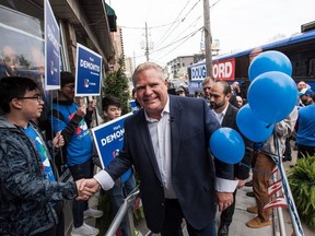 Ontario Progressive Conservative leader Doug Ford greets supporters during Mark DeMontis campaign office opening for York South-Weston in Toronto on Saturday, May 12, 2018.