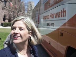 Ontario NDP Leader Andrea Horwath steps on to her campaign bus before a campaign event in Toronto on Wednesday, May 9 , 2018.