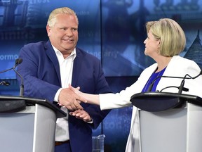 Ontario Progressive Conservative Leader Doug Ford, left, and Ontario NDP Leader Andrea Horwath shake hands at the end of the third and final televised debate of the provincial election campaign in Toronto, Sunday, May 27, 2018. THE CANADIAN PRESS/Frank Gunn