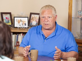 Ontario Progressive Conservative leader Doug Ford at a campaign stop in the kitchen of Bill and Linda Reid in Reeces Corners, Ont. on Wednesday. Geoff Robins/The Canadian Press