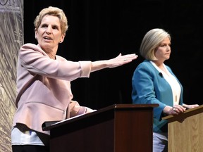 Ontario Liberal Leader Kathleen Wynne, left, and Ontario NDP Leader Andrea Horwath take part in the second of three leaders' debate in Parry Sound, Ont., on Friday, May 11, 2018. THE CANADIAN PRESS/Nathan Denette