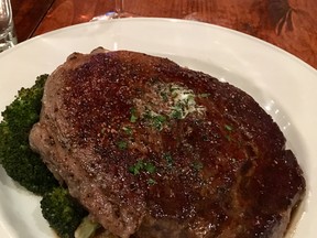 Texas ribeye steak served on top of roasted fingerling potatoes, broccoli, marchand de vin sauce. Ling Hui/Postmedia Network)