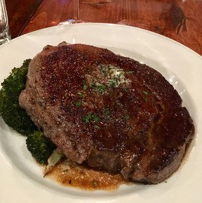 Texas ribeye steak served over a bed of roasted fingerling potatoes, broccoli with marchand de vin sauce at Otto’s. (Ling Hui/Postmedia Network)