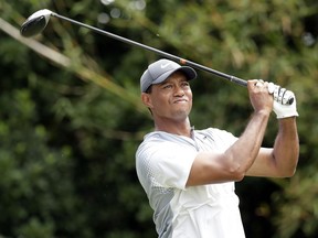 Tiger Woods hits a shot from the 11th tee during the third round of the The Players Championship golf tournament Saturday, May 12, 2018, in Ponte Vedra Beach, Fla.