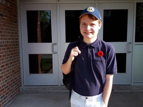 Scott Smith wears a poppy to school.