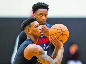 Delon Wright works on his shot at yesterday’s Raptors practice while OG Anunoby looks on.  (Ernest Doroszuk, Toronto sun)