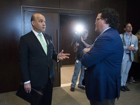 Jim Balsillie, Council of Canadian Innovators, left, talks with Colin McKay, Google Canada, as they arrive to appear as witnesses at a Commons privacy and ethics committee in Ottawa on Thursday, May 10, 2018, hearing witnesses on the breach of personal information involving Cambridge Analytica and Facebook.