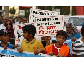 Members of the Thorncliffe community marched through the streets on Monday September 7, 2015 before arriving at Thorncliffe Park Public School to protest the Ontario Liberal government's institution of Sex-Ed curriculum. Jack Boland/Toronto Sun