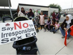 Members of the Thorncliffe community marched through the streets on Tuesday September 8, 2015 before arriving at Thorncliffe Park Public School to protest the Ontario Liberal government's institution of Sex-Ed curriculum. Many said they will pull their children from school when it starts today . Jack Boland/Toronto Sun/Postmedia Network