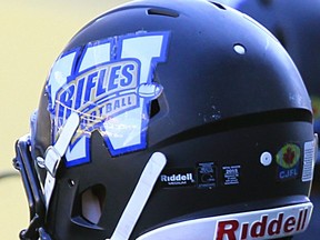 Winnipeg Rifles QB Jamie Ybarra Jr. (right) relaxes with teammate Julian Banares late in a victory over the Edmonton Wildcats during Canadian Junior Football League action at Investors Group Field in Winnipeg on Sun., Sept. 27, 2015. Kevin King/Winnipeg Sun/Postmedia Network