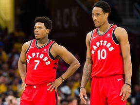 Kyle Lowry and DeMar DeRozan of the Toronto Raptors during Game 4 against the Cleveland Cavaliers at Quicken Loans Arena on May 7, 2018