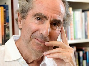 In this Sept. 8, 2008, file photo, author Philip Roth poses for a photo in the offices of his publisher, Houghton Mifflin, in New York.