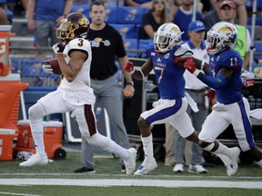Central Michigan wide receiver Mark Chapman (3) is chased by Kansas defenders as he runs the ball 75 yards for a touchdown during an NCAA game on Sept. 9, 2017