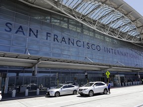 In this Tuesday, July 11, 2017, file photo, vehicles wait outside the international terminal at San Francisco International Airport in San Francisco. (AP Photo/Marcio Jose Sanchez, File)