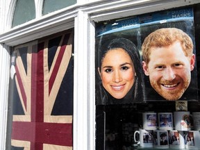 Masks of Prince Harry and his fiance, Meghan Markle, sit in the window of a gift shop on May 10, 2018 in Windsor, England. (Photo by Jack Taylor/Getty Images)