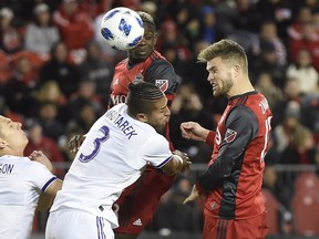 TFC forward Eriq Zavaleta (15) heads the ball past Orlando defender Amro Tarek during a TFC win last week. Nathan Denette/CP