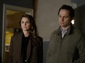 This image released by FX shows Keri Russell, left, and Matthew Rhys in a scene from "The Americans." (Patrick Harbron/FX via AP) ORG XMIT: NYET216