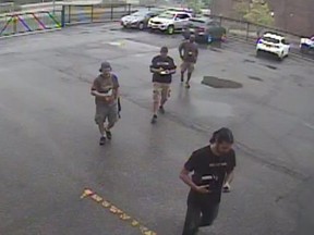 Peel Regional Police officers Manuel Pinheiro, Richard Rerrie, Damian Savino and Mihai Muresan are seen on security video arriving at a storage facility to execute a search warrant on an accused drug dealer's locker on June 24, 2014.