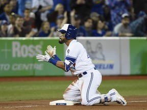Devon Travis was back in the Blue Jays lineup on Tuesday night after spending 14 games with triple-A Buffalo. (Nathan Denette/The Canadian Press)