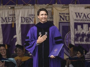 Canadian Prime Minister Justin Trudeau acknowledges the crowd after receiving an honorary doctor of laws degree at New York University's commencement ceremony at Yankee Stadium in New York City on Wednesday, May 16, 2018.
