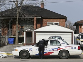 Police investigate at 160 Playfair Ave, Toronto on Saturday January 30, 2016. Domenico Scopelliti, 51, of Toronto, is the  suspect in the homicide that  took place at this location Friday night. Veronica Henri/Toronto Sun/Postmedia Network