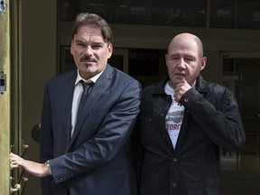 Mike Bullard, right, leaves College Park Court with his lawyer, William Halkiw, June 28, 2017. Craig Robertson/Toronto Sun