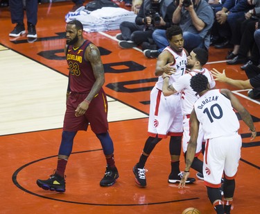 Toronto Raptors Fred VanVleet is held back during 1st half action against Cleveland Cavaliers LeBron James in Eastern Conference Semifinals at the Air Canada Centre at the Air Canada Centre in Toronto, Ont. on Tuesday May 1, 2018. Ernest Doroszuk/Toronto Sun/Postmedia Network