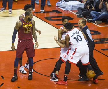 Toronto Raptors Fred VanVleet is held back during 1st half action against Cleveland Cavaliers LeBron James in Eastern Conference Semifinals at the Air Canada Centre at the Air Canada Centre in Toronto, Ont. on Tuesday May 1, 2018. Ernest Doroszuk/Toronto Sun/Postmedia Network